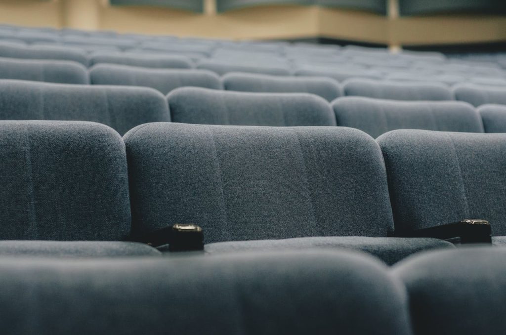 Close-up view of empty auditorium seats, perfect for conference or event themes.
