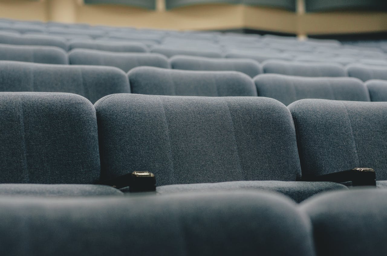 Close-up view of empty auditorium seats, perfect for conference or event themes.